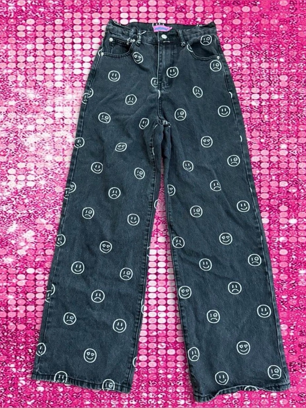 Edikted black jeans with white smiley face and sad face emojis, size S
